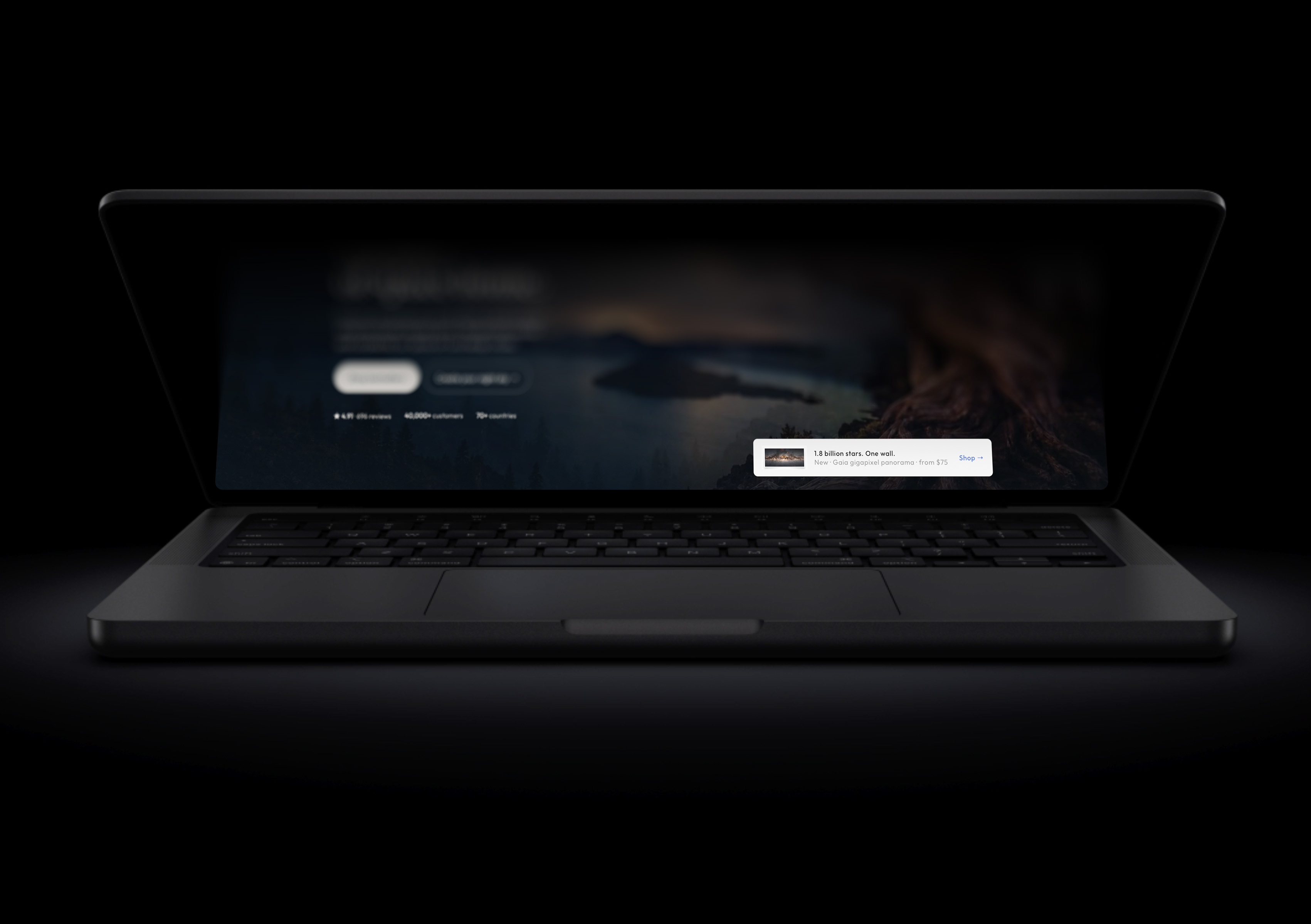A MacBook with the lid half closed. The screen content folds away, blurred and darkened towards the far edge.